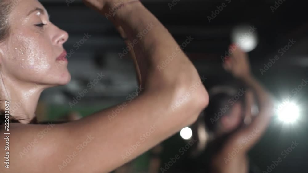 Close up woman practice yoga hot in studio rapid slow motion