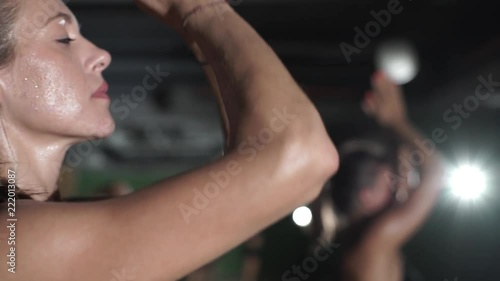 Close up woman practice yoga hot in studio rapid slow motion