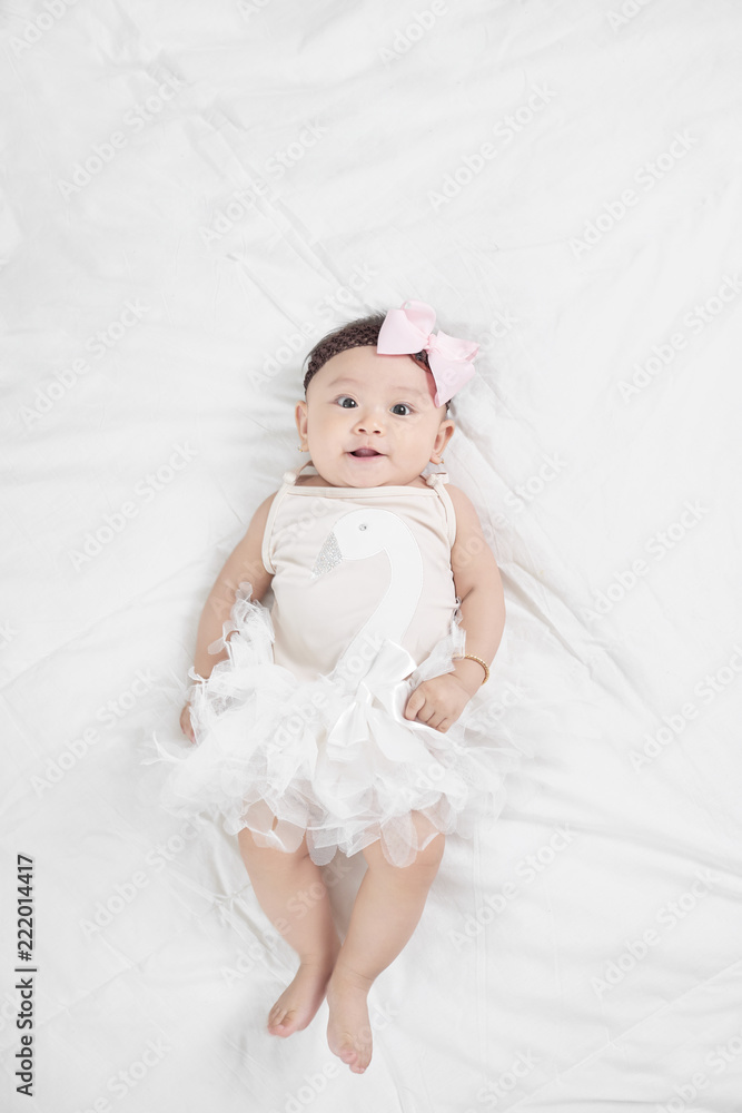 Asian baby girl laying on floor Asian baby girl laying on floor