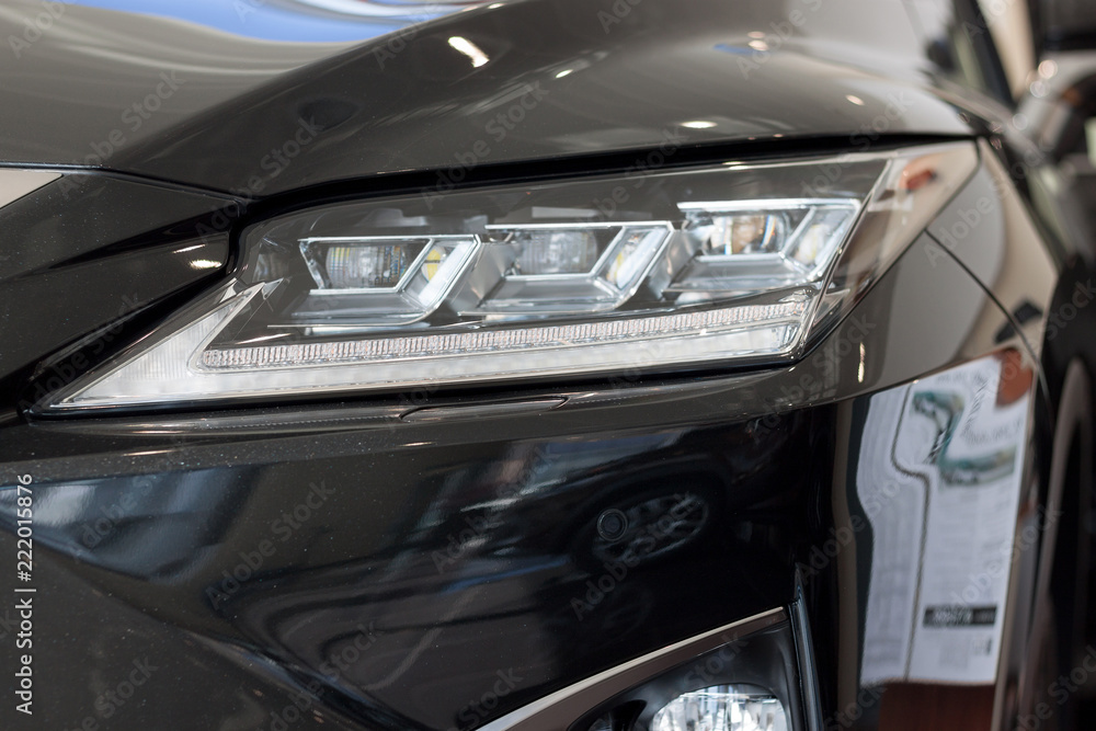 New modern vehicle with elegant head lamps. Front view. New modern vehicle with elegant head lamps. Front view.