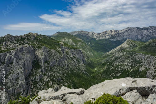 Landscape rocky mountains national park "Paklenica" in Croatia. Peaks of rocky hills with occasionally vegetation.