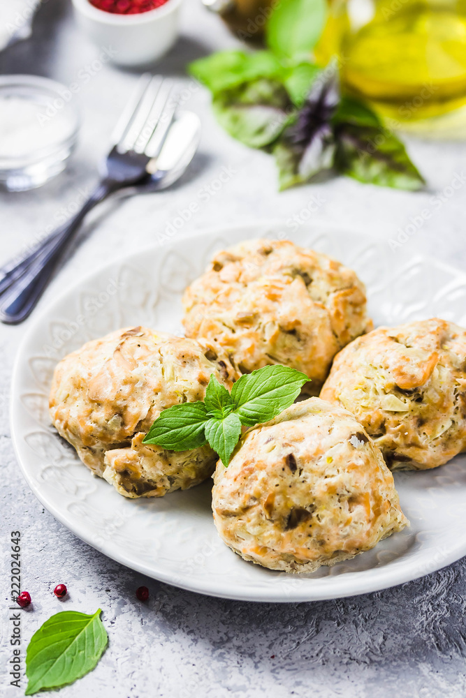 Oven baked salmon patties with herbs. Selective focus, space for text.