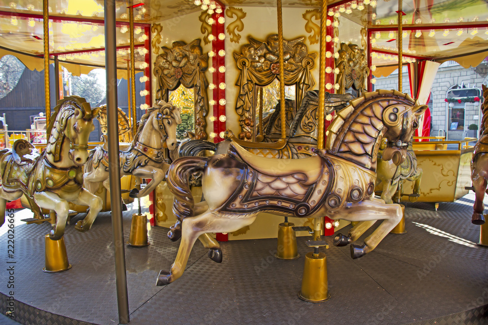Old fashioned french carousel with horses