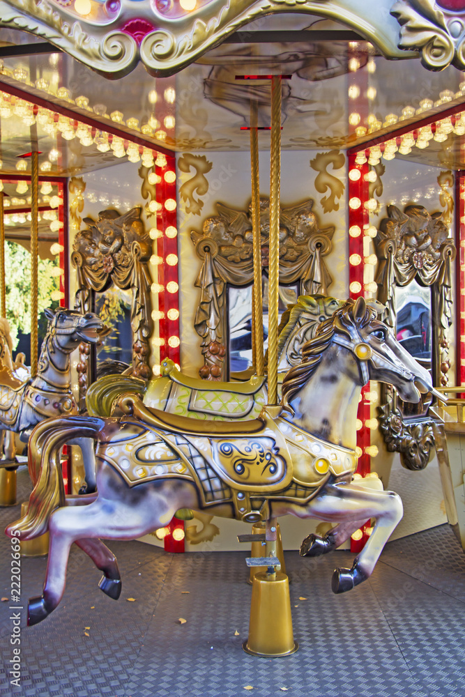 Old fashioned french carousel with horses