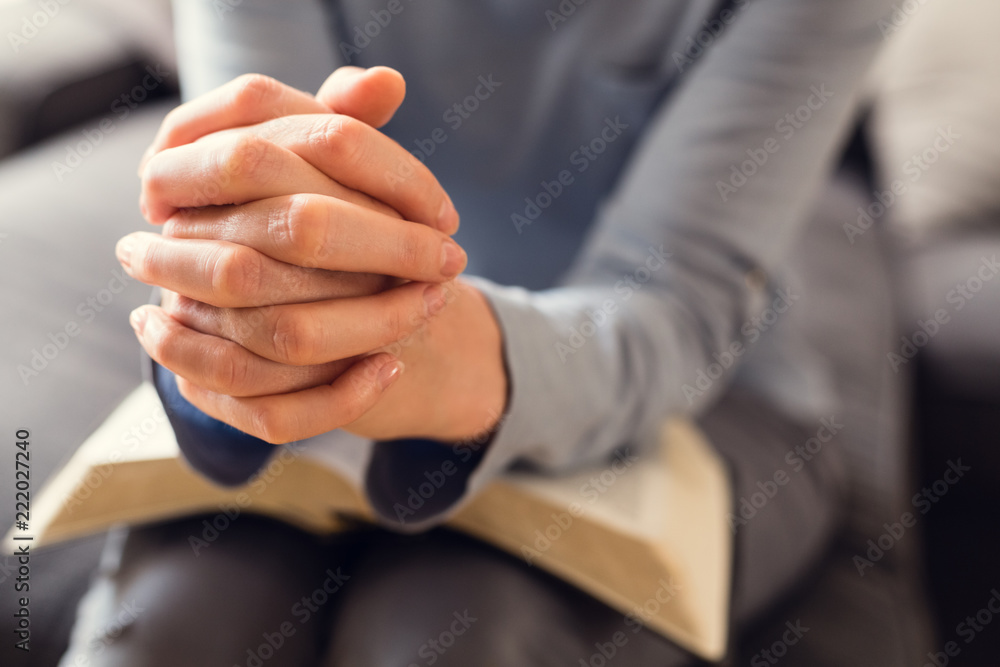 Fototapeta premium Bible Study and Faith - Woman Praying with an Open Bible