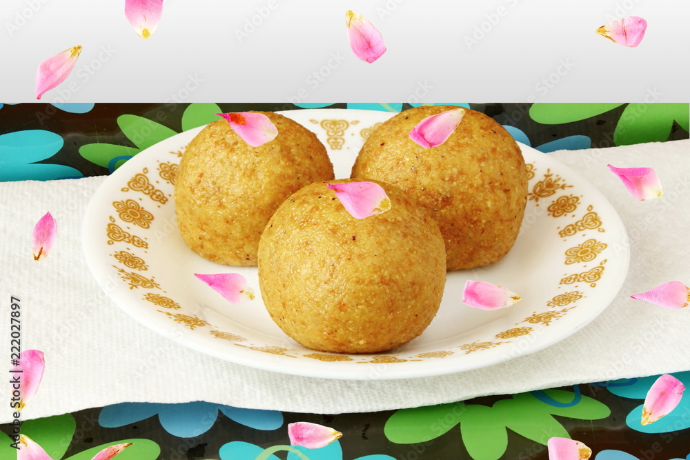Popular traditional Indian gujarati mithai or sweet laddu,ladoo,motichur,garnish with rose petal