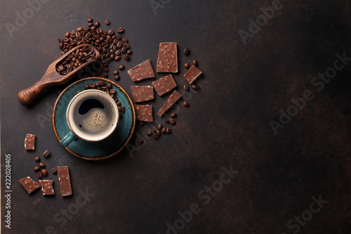 Coffee cup and chocolate on old kitchen table