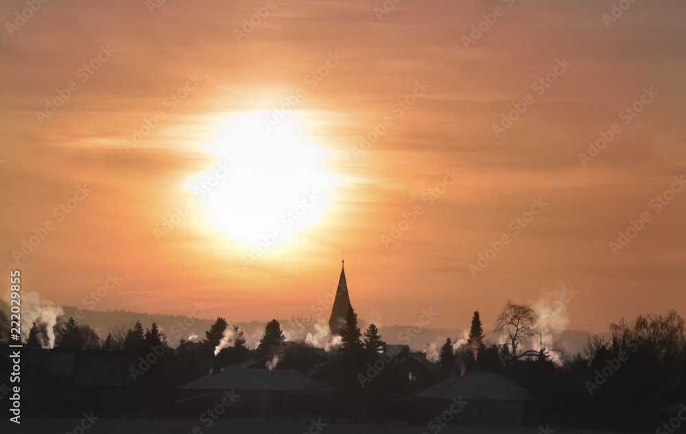 Obraz premium Colorful winter sunrise over village