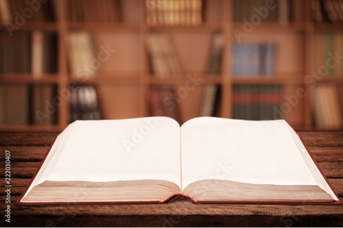 Open book on old wooden table
