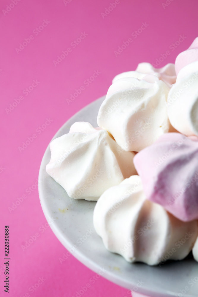 Meringue. Crispy white and pink twisted meringue. Concept love of sweet