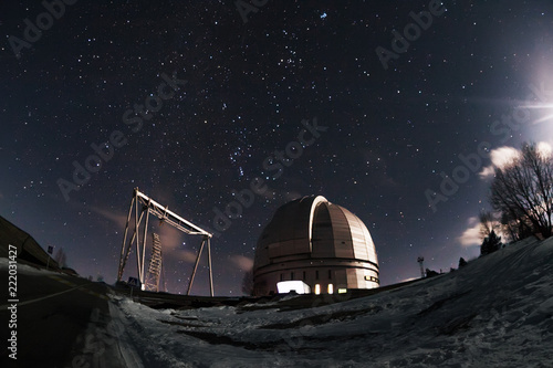 The view of the telescope BTA on a dark background of a starry sky. Arkhyz. Night astrophotography. Karachay-Cherkessia. SAO RAS.