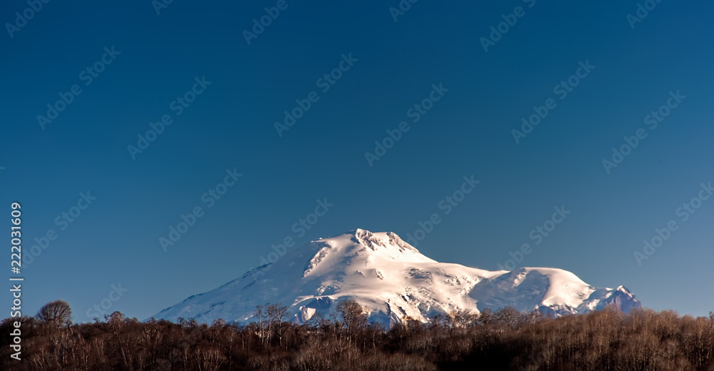 View to the Elbrus mountain in clear weather from a distance of 100 km. Arkhyz