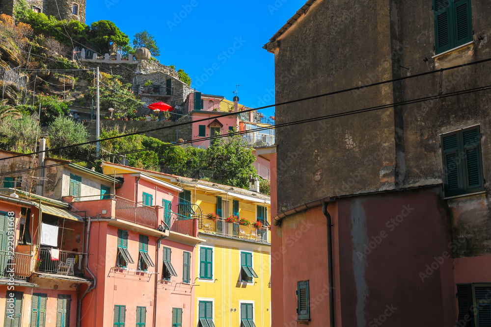 View on the beautiful colourful houses in Cinque Terre, Italy on a sunny day.