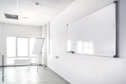 Empty presentation room with whiteboard.