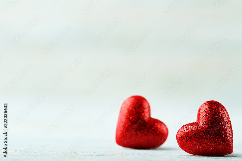 Fototapeta premium Red hearts on white wooden table