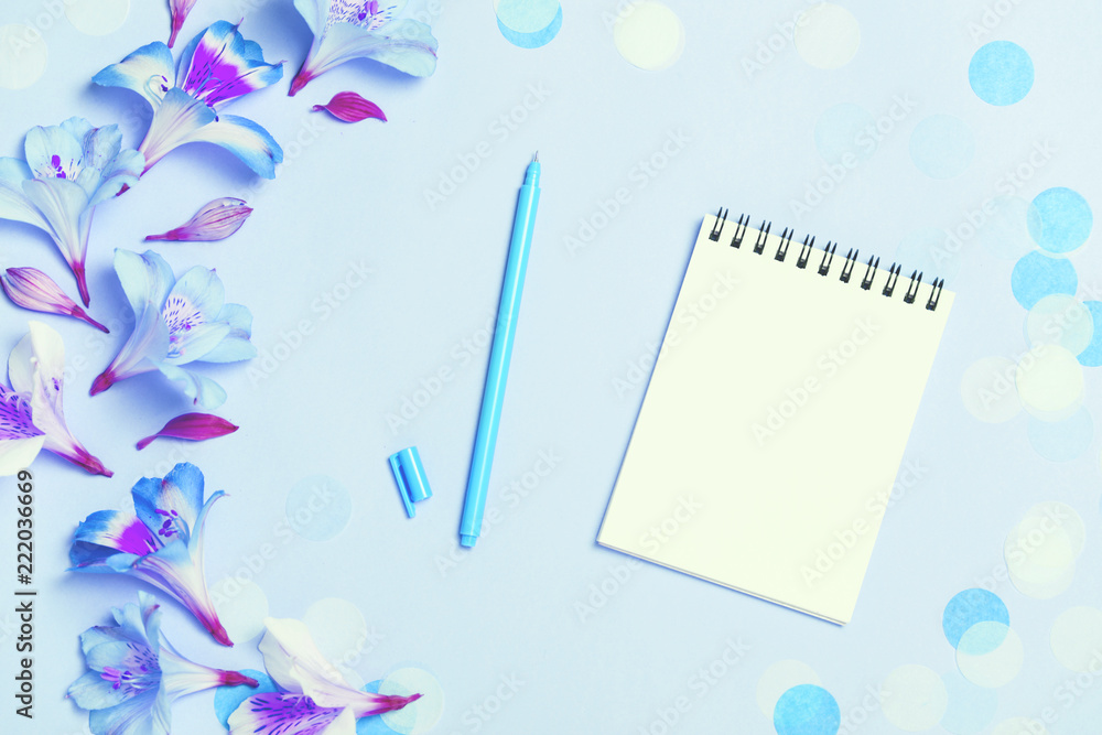 Empty note pad on festive confetti blue backgroung. Empty note pad on festive confetti blue backgroung.