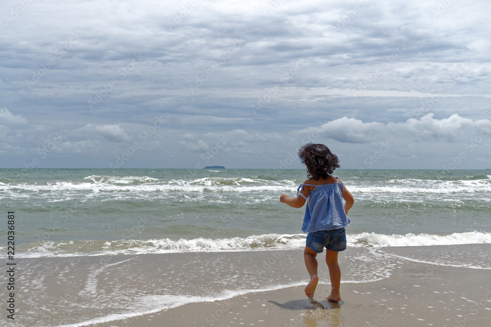 little girl happiest on the beach 