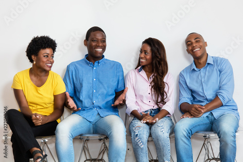 Fotografie Talking african american group of people in waiting room