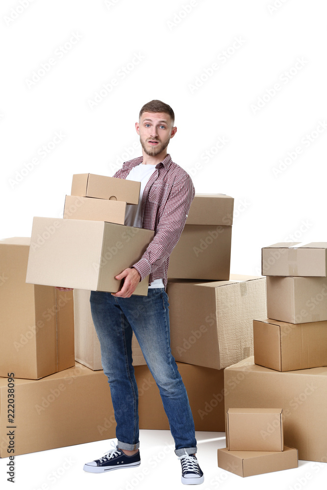 Young man with cardboard boxes on white background Young man with cardboard boxes on white background