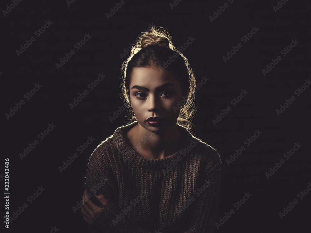Fototapeta premium Classic shot of a Sexy Woman wearing a Sweater off the Shoulder