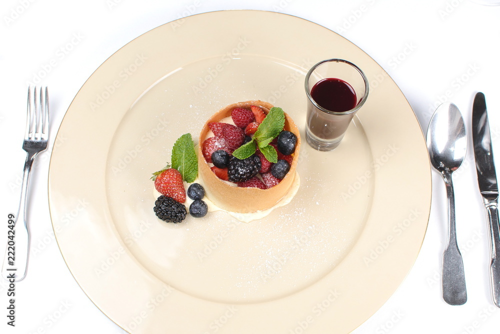 dessert with fruit and berry sauce dessert with fruit and berry sauce