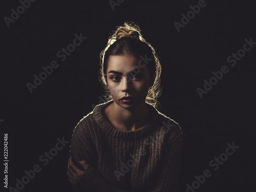 Classic shot of a Sexy Woman wearing a Sweater off the Shoulder