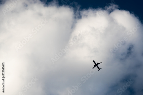 The plane flies in the clouds