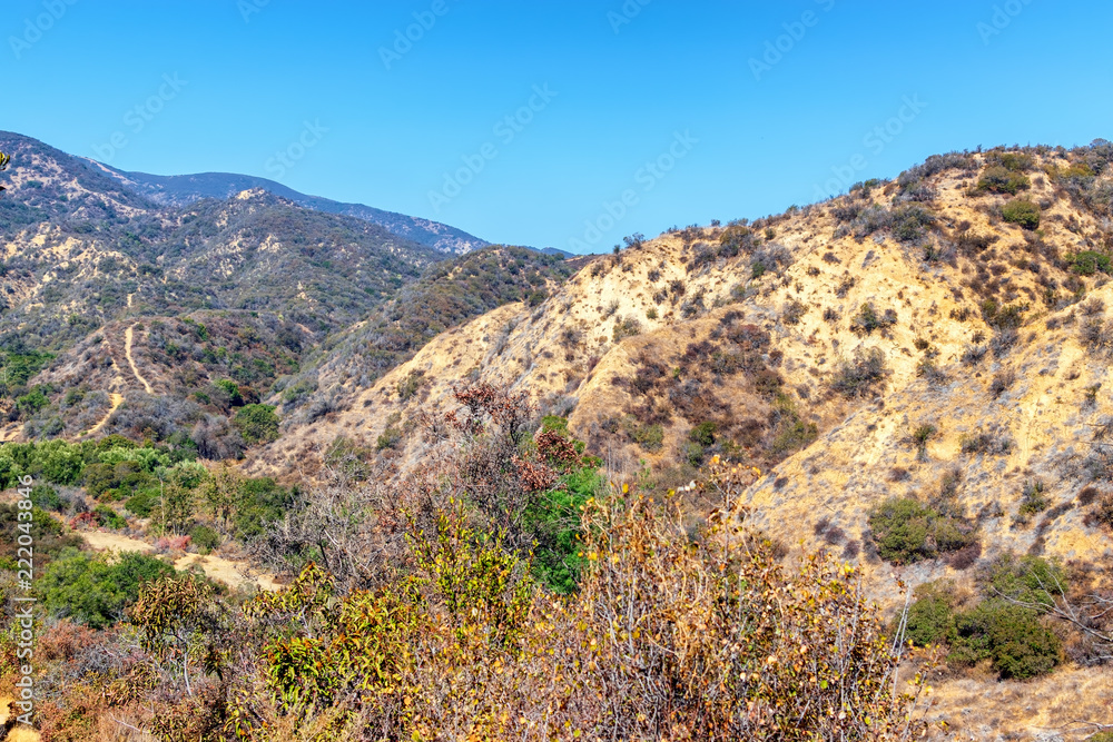 Desert mountains of California with dry hillsides and bright summer sun Desert mountains of California with dry hillsides and bright summer sun