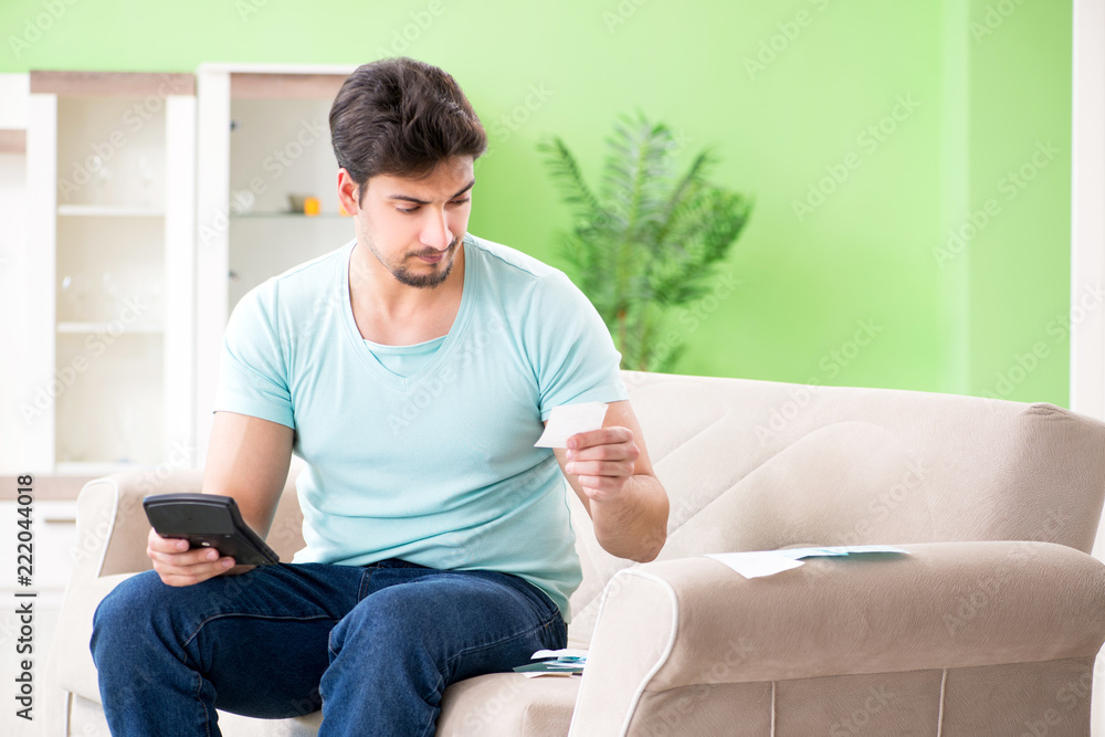 Young man struggling with personal finance and bills Young man struggling with personal finance and bills