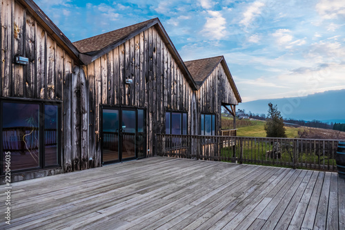 Wallpaper Mural Wood deck and building in the Finger Lakes overlooking vineyards and Seneca Lake Torontodigital.ca