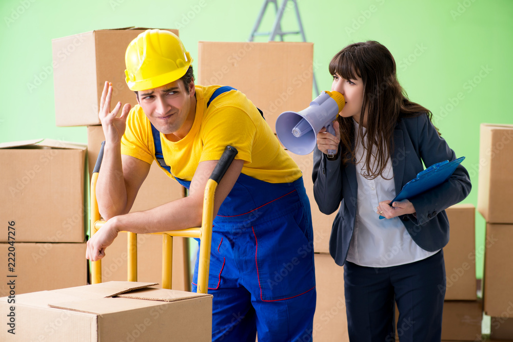 Woman boss and man contractor working with boxes delivery Woman boss and man contractor working with boxes delivery