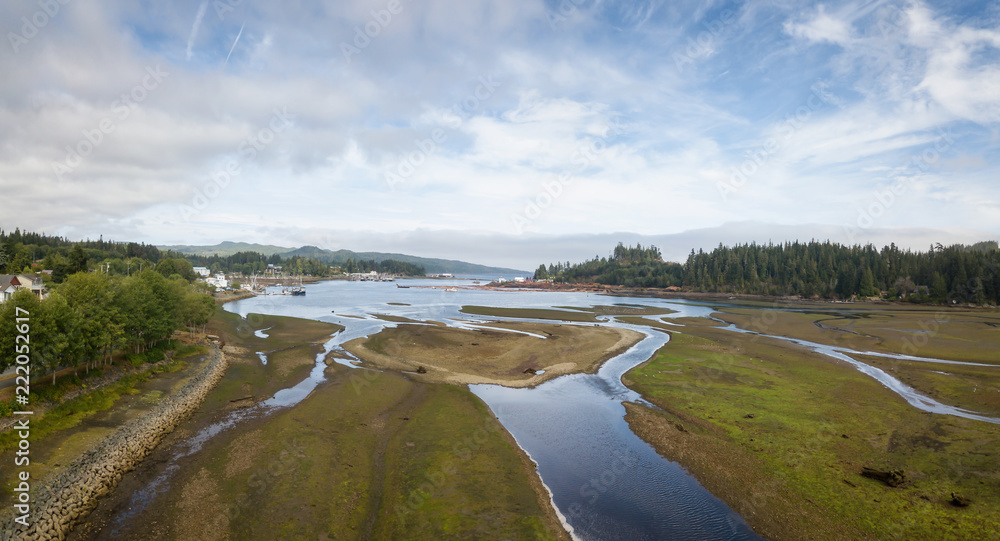 Aerial panoramic view of a small town, Port Hardy, during a cloudy summer day. Located in Northern Vancouver Island, BC, Canada.