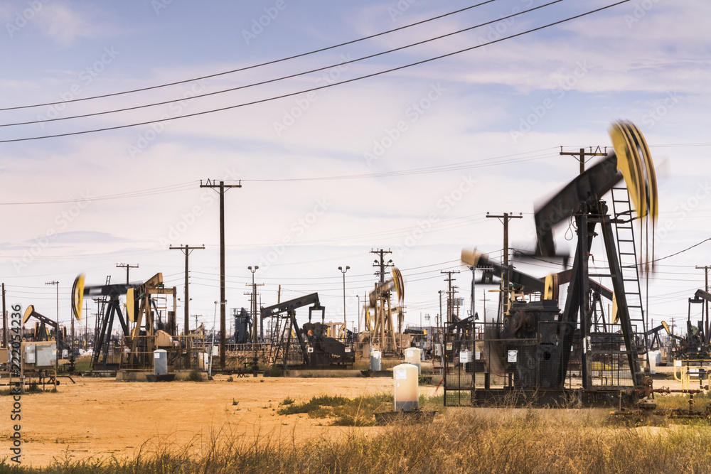 Crude oil pumps natural resources from the ground in California USA Crude oil pumps natural resources from the ground in California USA