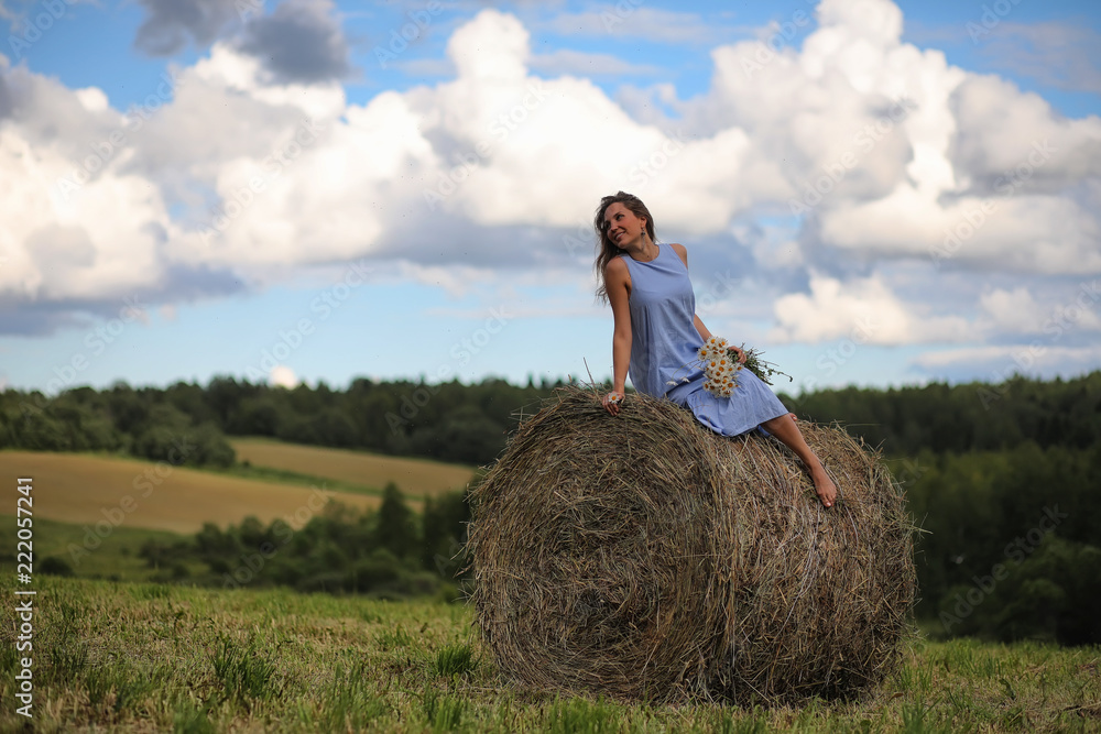 Two girls in dresses in summer field Two girls in dresses in summer field
