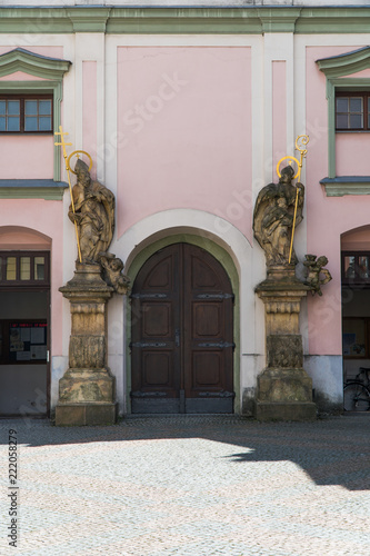 Church stone art figures and columns on ancient facade in Czech Rebublic, historical city. photo