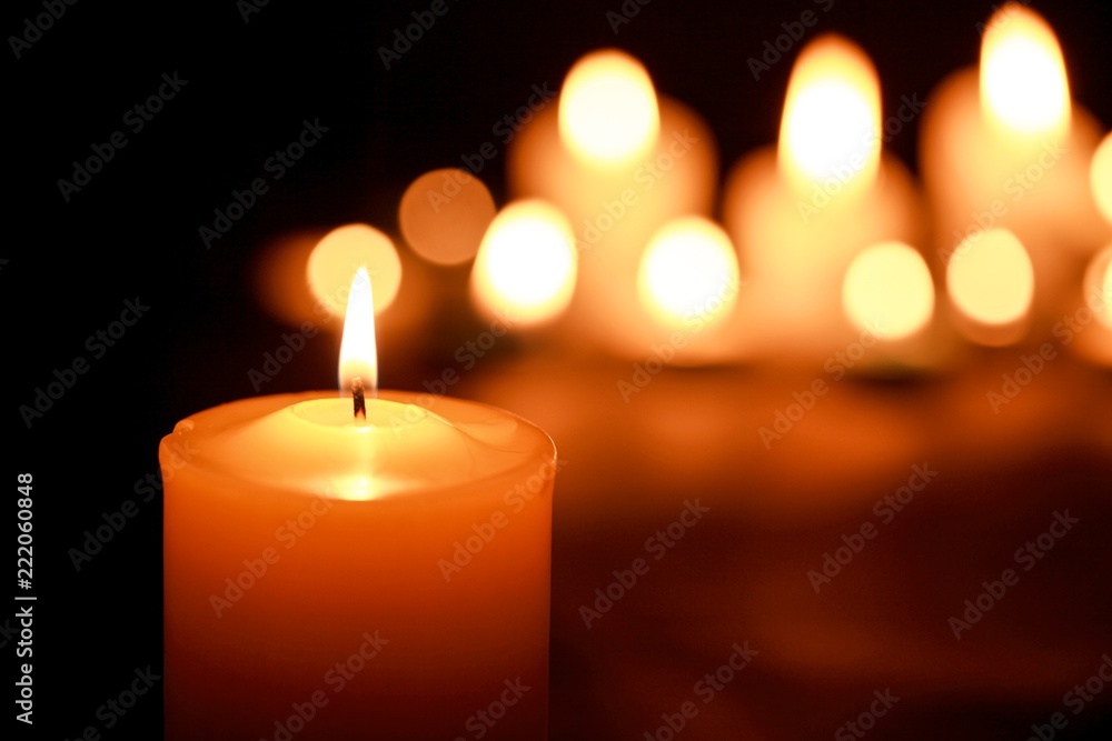 Candle in Focus with Blurred Candles in the Background Candle in Focus with Blurred Candles in the Background