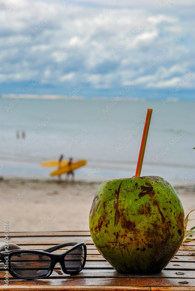 Green coconut on the palm tree