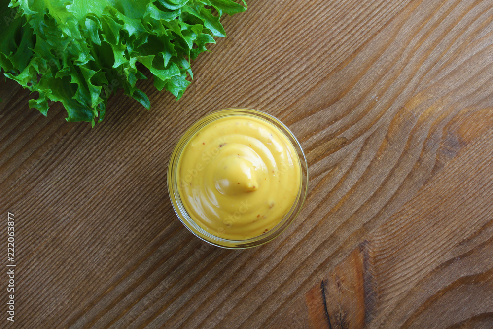mustard sauce on a wooden background mustard sauce on a wooden background