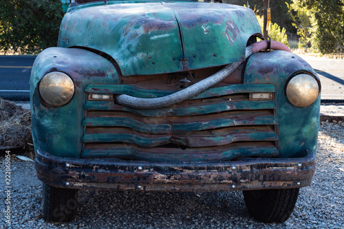 Vintage really old blue  green turquoise truck parked by the road