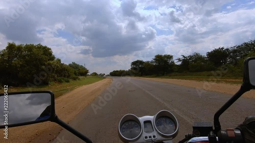 Riding north of Johannesburg with a GoPro strapped to my chest on a road that is not in great condition photo