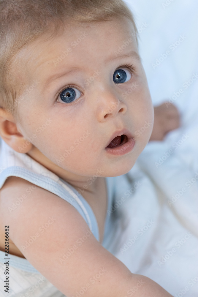 Thoughtful calm little blue eyed baby boy Thoughtful calm little blue eyed baby boy