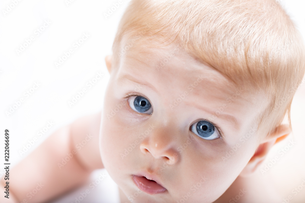 Adorable newborn baby bay with large blue eyes Adorable newborn baby bay with large blue eyes