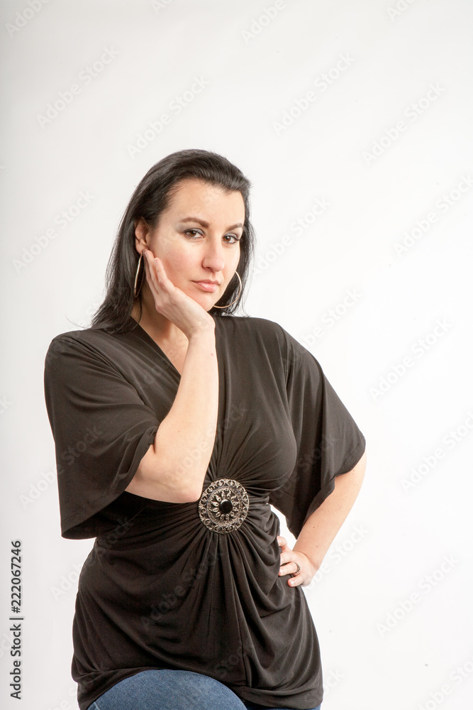 40 Something brunette woman in the studio with a white background 40 Something brunette woman in the studio with a white background
