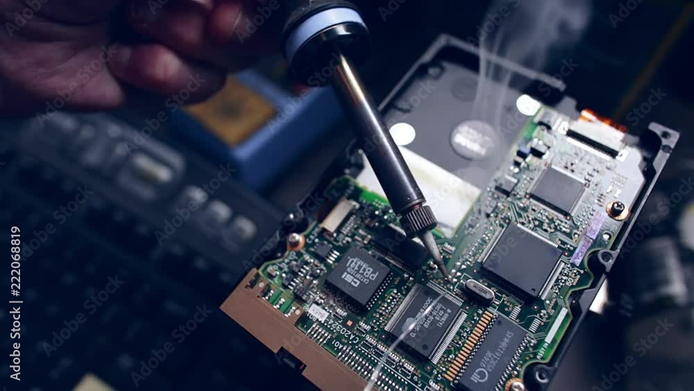 Vidéo Stock slow motion footage of solder smoking when hitting hot soldering iron Adobe Stock