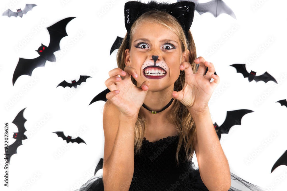 Smiley girl with black cat costume, halloween makeup and black and orange  balloons at halloween party, pumpkin patch. Halloween kids. Stock Photo |  Adobe Stock