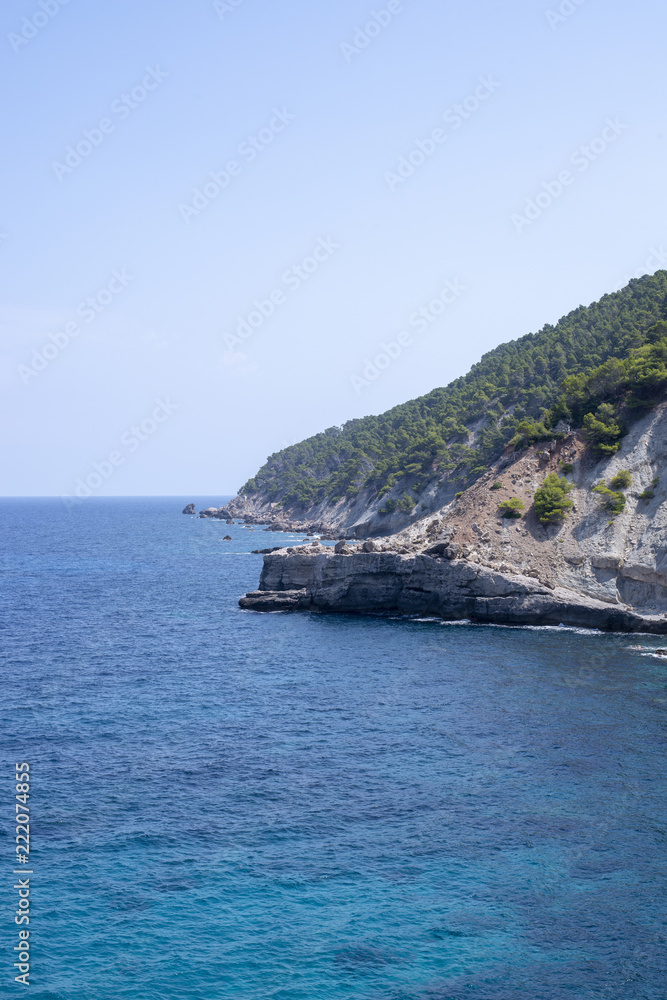 Tranquil Blue Sea by the Foot of a Mallorcan Limestone Mountain