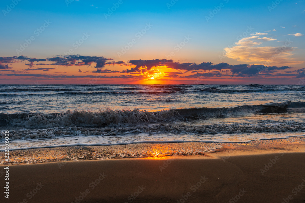 Bright colorful sunrise on the seashore