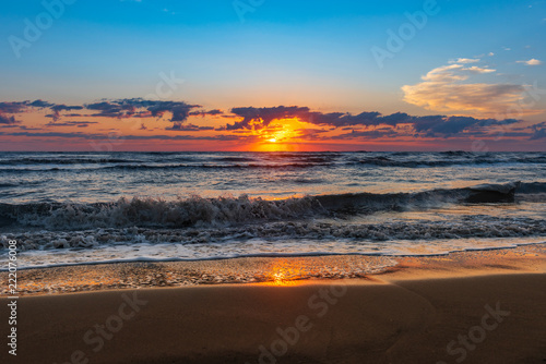 Bright colorful sunrise on the seashore