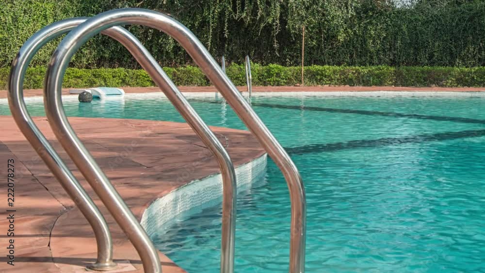 Hotel swimming pool with sunny reflections Hotel swimming pool with sunny reflections