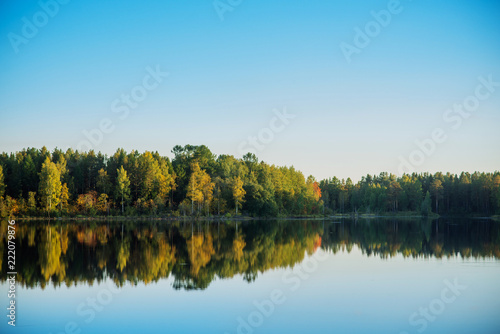 Fototapeta Naklejka Na Ścianę i Meble -  natural background, landscape: Golden autumn, lake surrounded by forest with colorful leaves